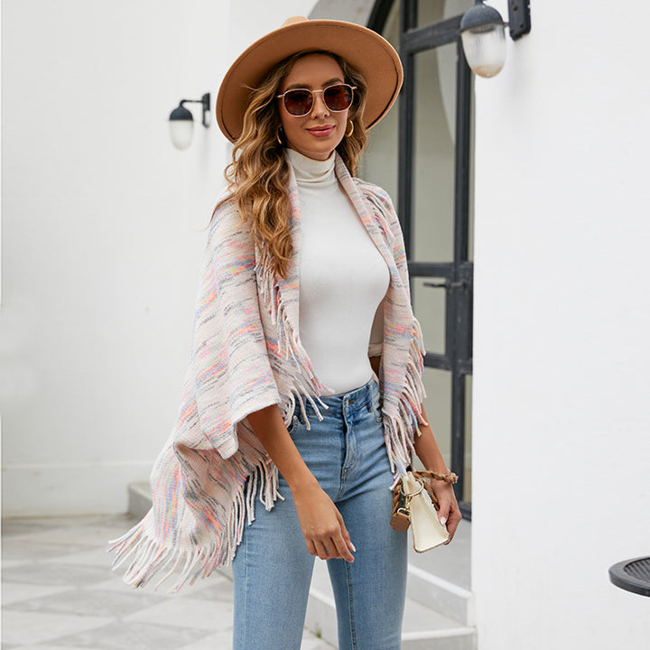 Ladies knitted poncho with luxurious fringes and a modern design Lune London