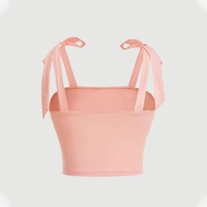 Short top for women with adjustable tie straps and ruffle details on the sides Chic & Stil