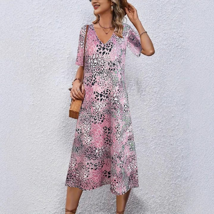 Fluid midi dress for women with eye-catching abstract patterns Lune London