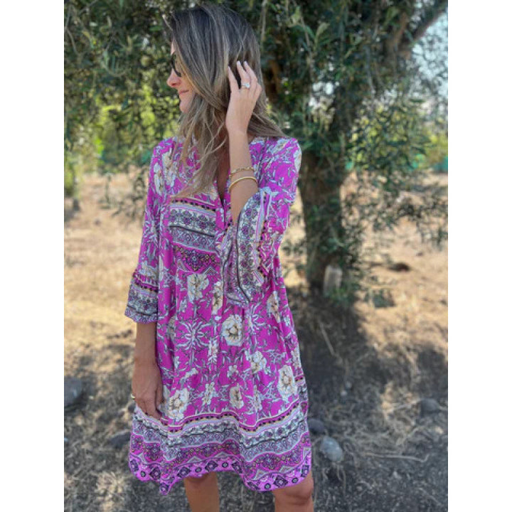 Casual blouse dress for women with a colorful floral pattern and a flared knee hem Lune London