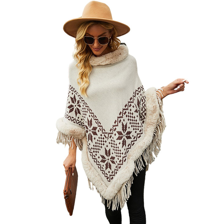 Elegant women's poncho with decorative fringe design and faux fur trim Lune London