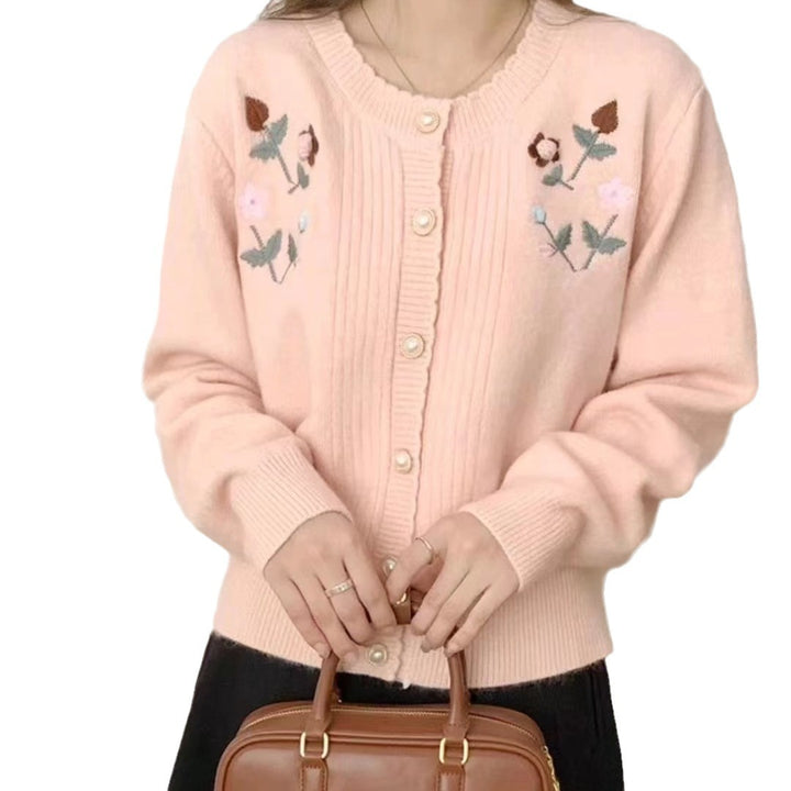 Women’s playful knitted vest with raised floral pattern and elegant pearl buttons Lune London
