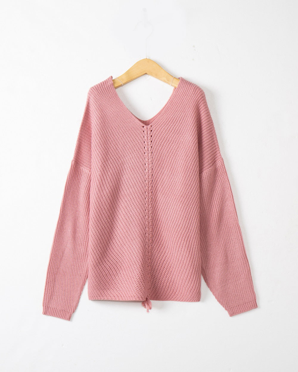 Women's thick knit sweater with an attractive V-neckline and practical drawstring details Lune London