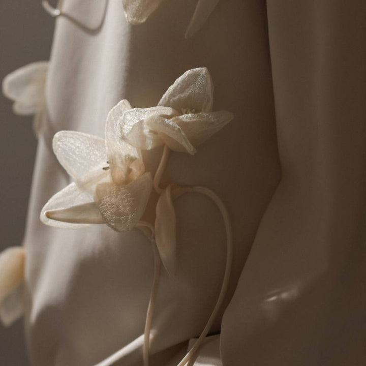 Women's sweatshirt with floral appliqués and a chic casual cut