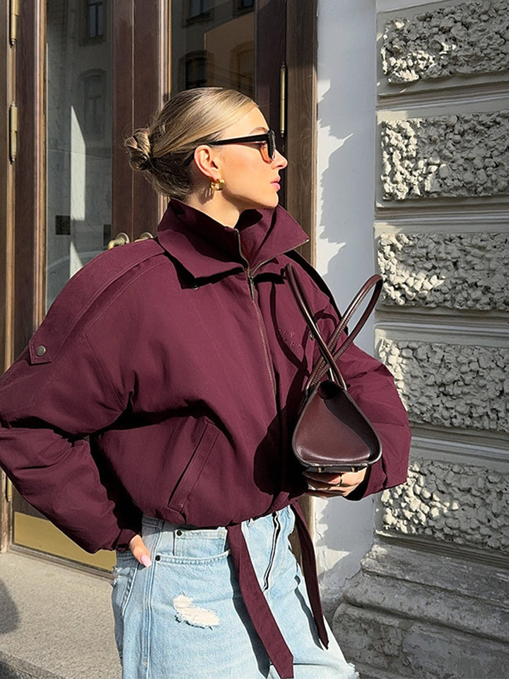 Modern oversized jacket for ladies with a high collar and a waist belt Lune London