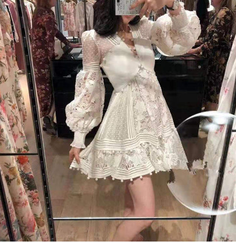 Women's playful floral dress with ruffle details and sheer puff sleeves Lune London
