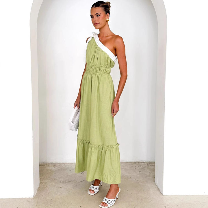 Women's maxi dress with asymmetrical shoulder design and flowing pleated skirt