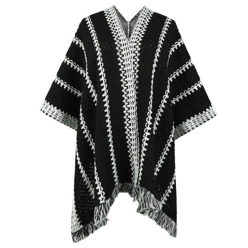 Knit poncho for women with V-neck and fringes Lune London