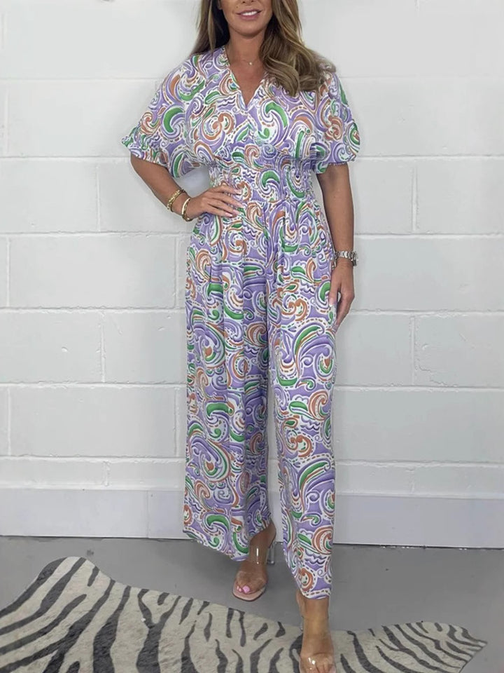 Lady Fluid jumpsuit with elegant paisley pattern and Lune London cinching