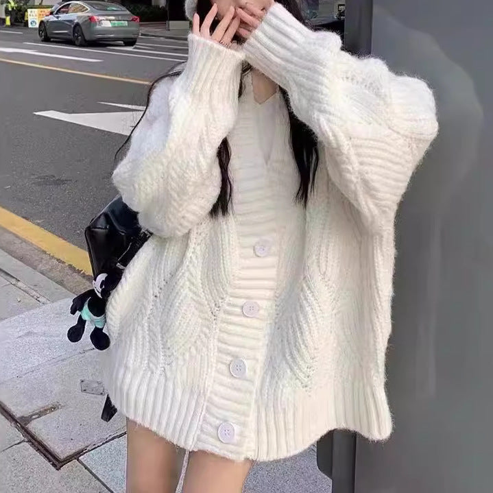Ladies oversized knit cardigan with oversized sleeves and large button details Lune London