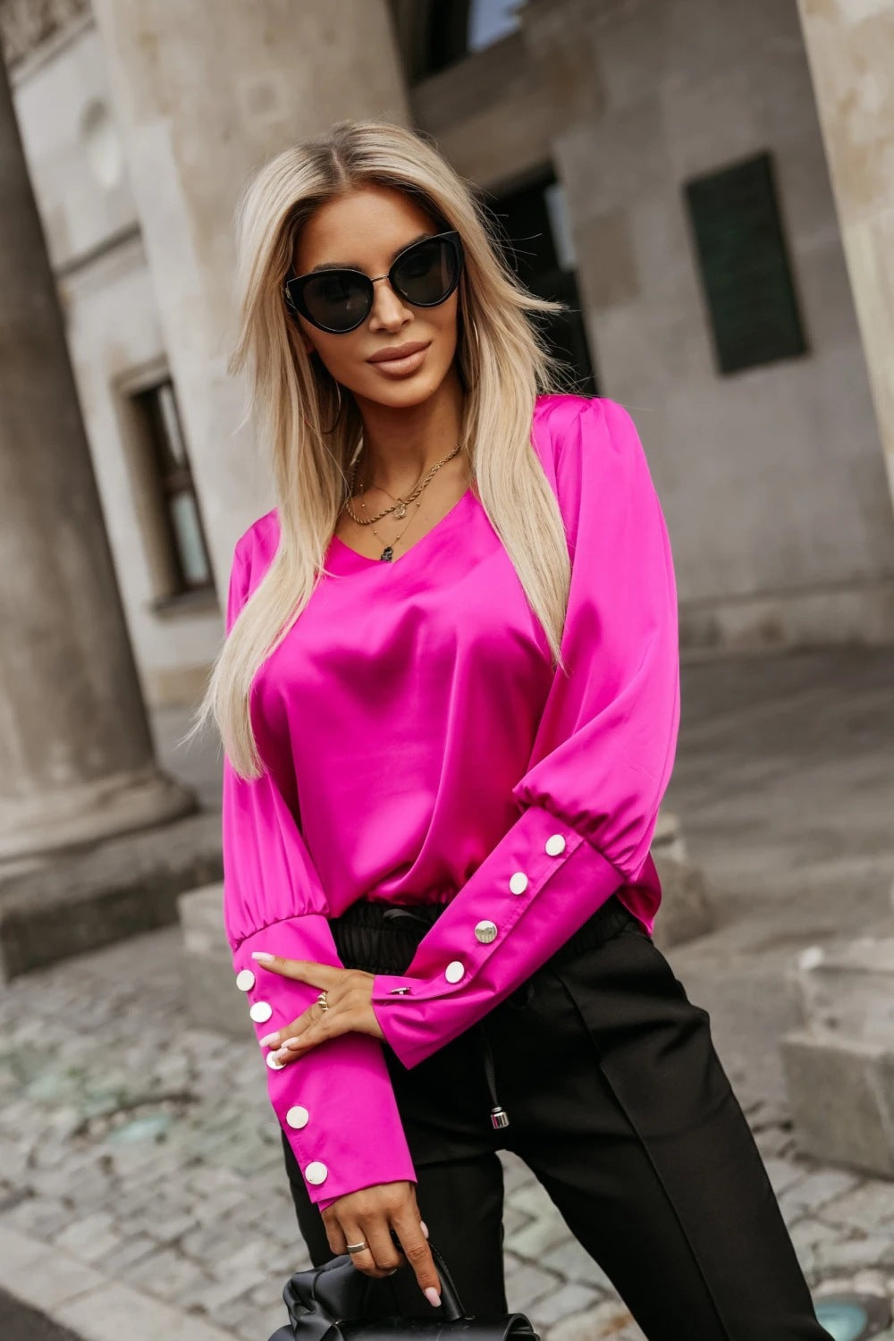Ladies' blouse with trendy puff sleeves and decorative button details Lune London