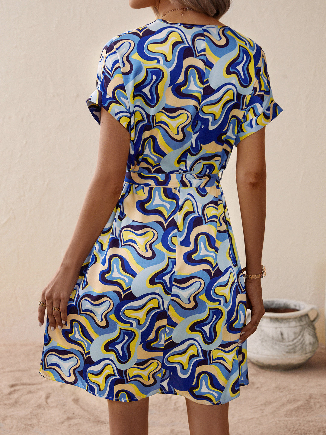 V neck dress for women with tie belt and modern pattern Lune London