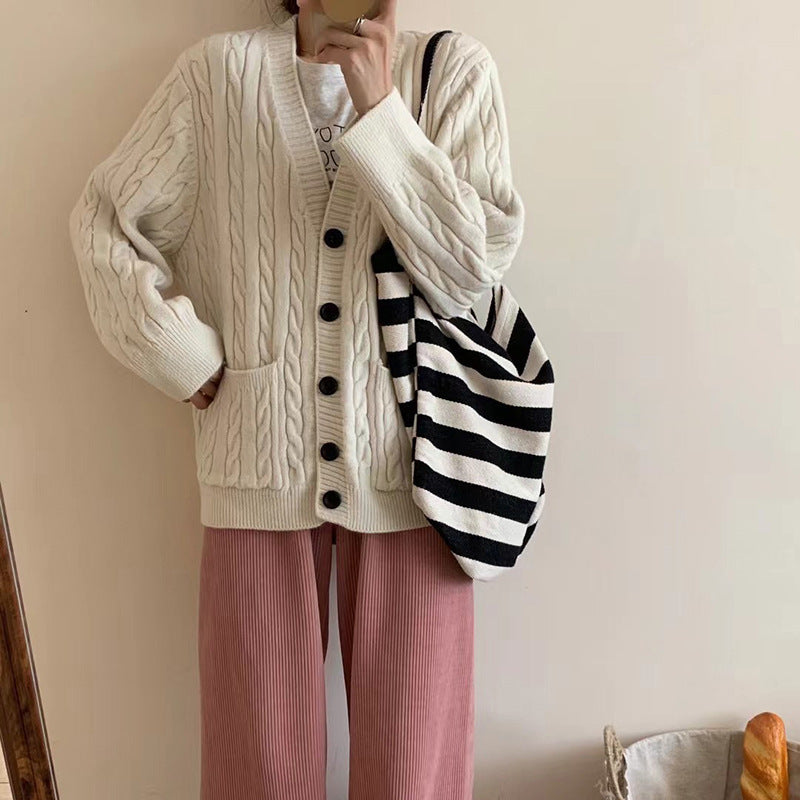 Ladies chunky knit vest with clover pattern and practical pockets Lune London