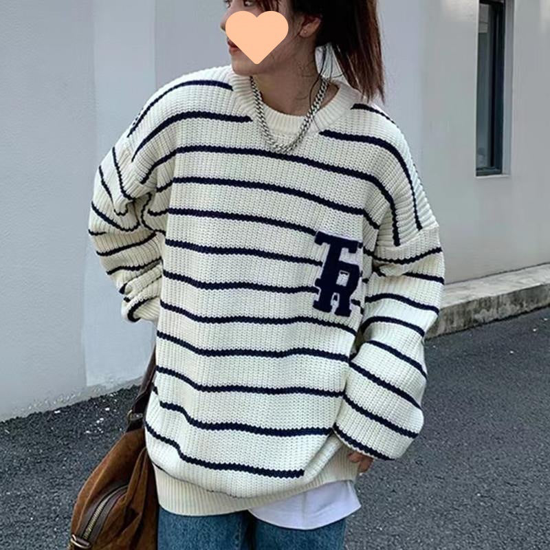 Casual oversized knit sweater for women with broken stripes and a chest pocket Lune London