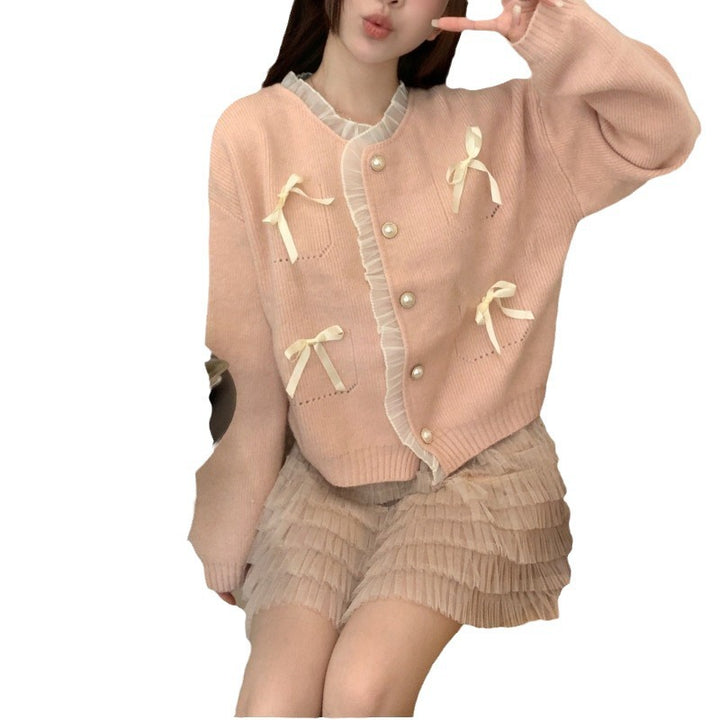 Knitted ladies' jacket with playful knots and pearl buttons Lune London