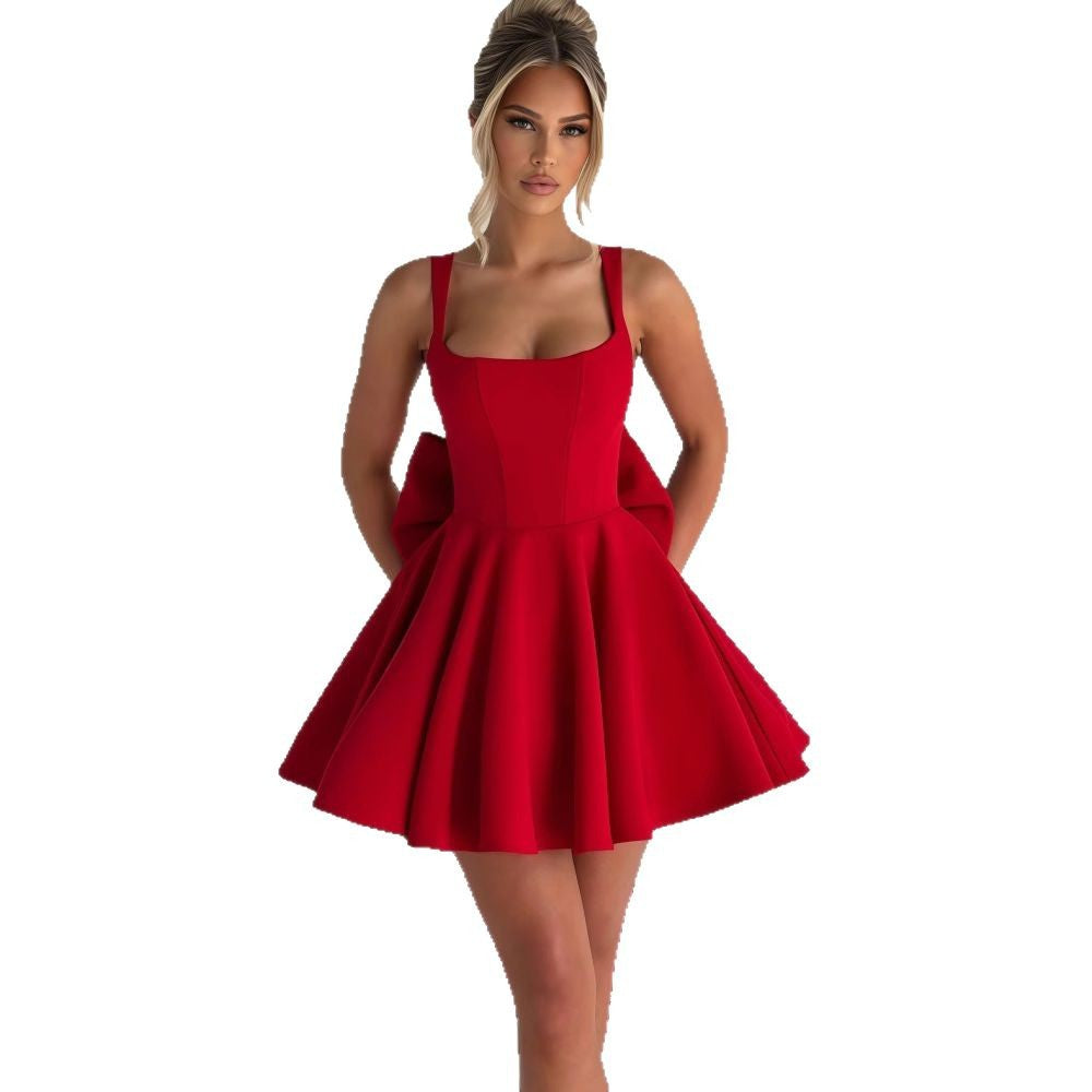 Women's cocktail dress with oversized bow design and flowing skirt Lune London