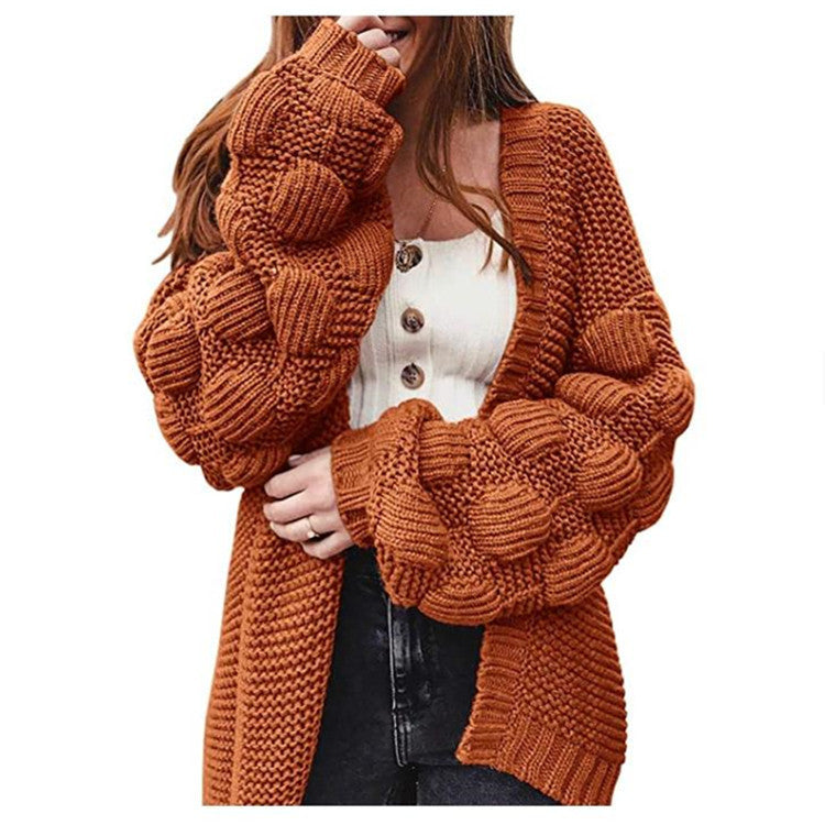 Knitted women's jacket with voluminous puff sleeves and a structured knit look Lune London