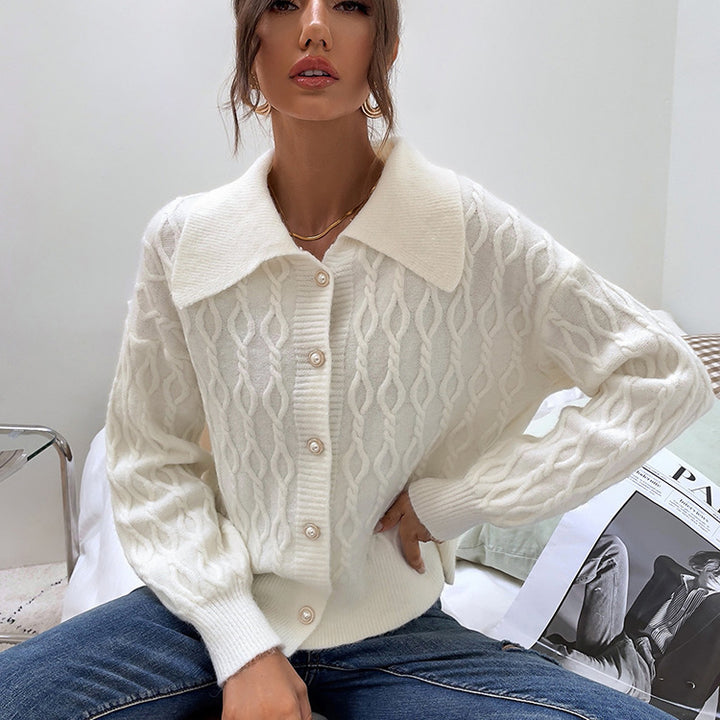Ladies chunky sweater with an elegant cable knit pattern and chic pearl buttons