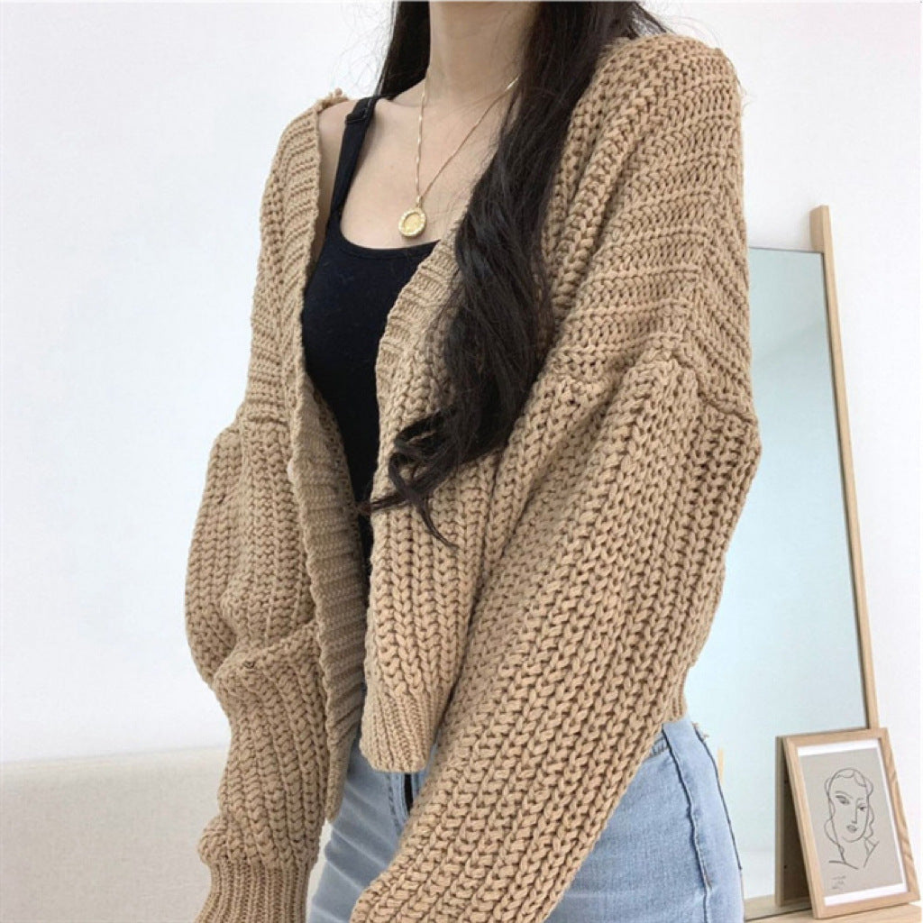 Ladies short cardigan with deep V-neck and special button details Lune London