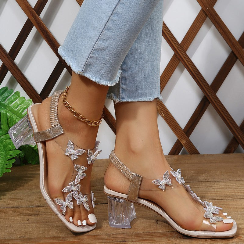 Glamour sandals for ladies with sparkling butterfly details and a transparent block heel Lune London
