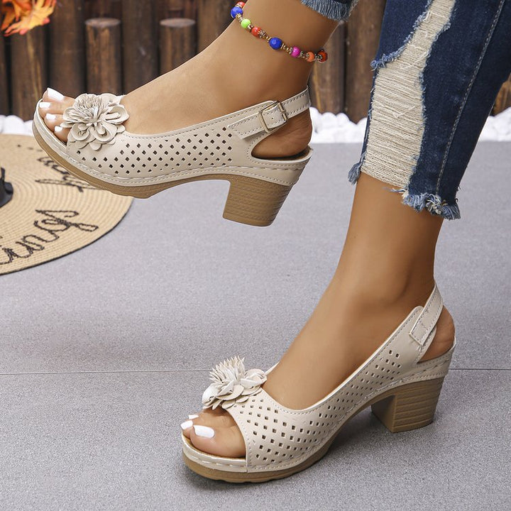 Women's clogs with a decorative floral detail and a perforated surface Lune London