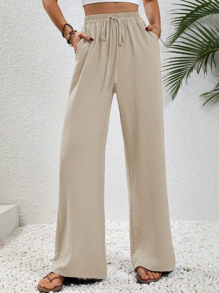 Pantalons larges d'été pour femmes avec taille élastique et poches latérales pratiques Chic & Stil