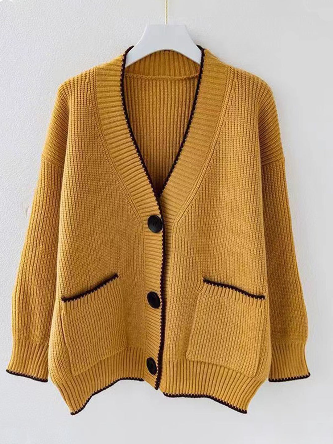 Ladies thick knit cardigan with deep V-neck and practical pockets Lune London