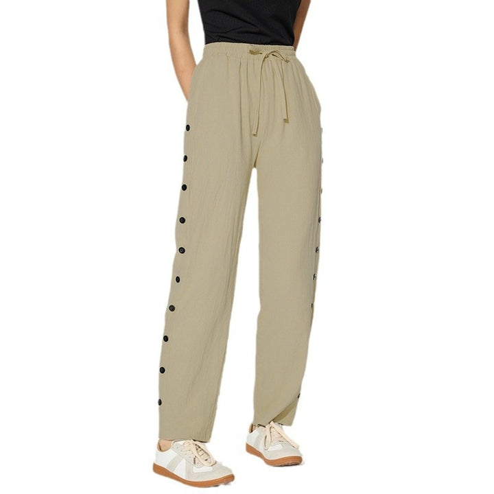Women's fashionable jogger pants with decorative button details Chic & Stil