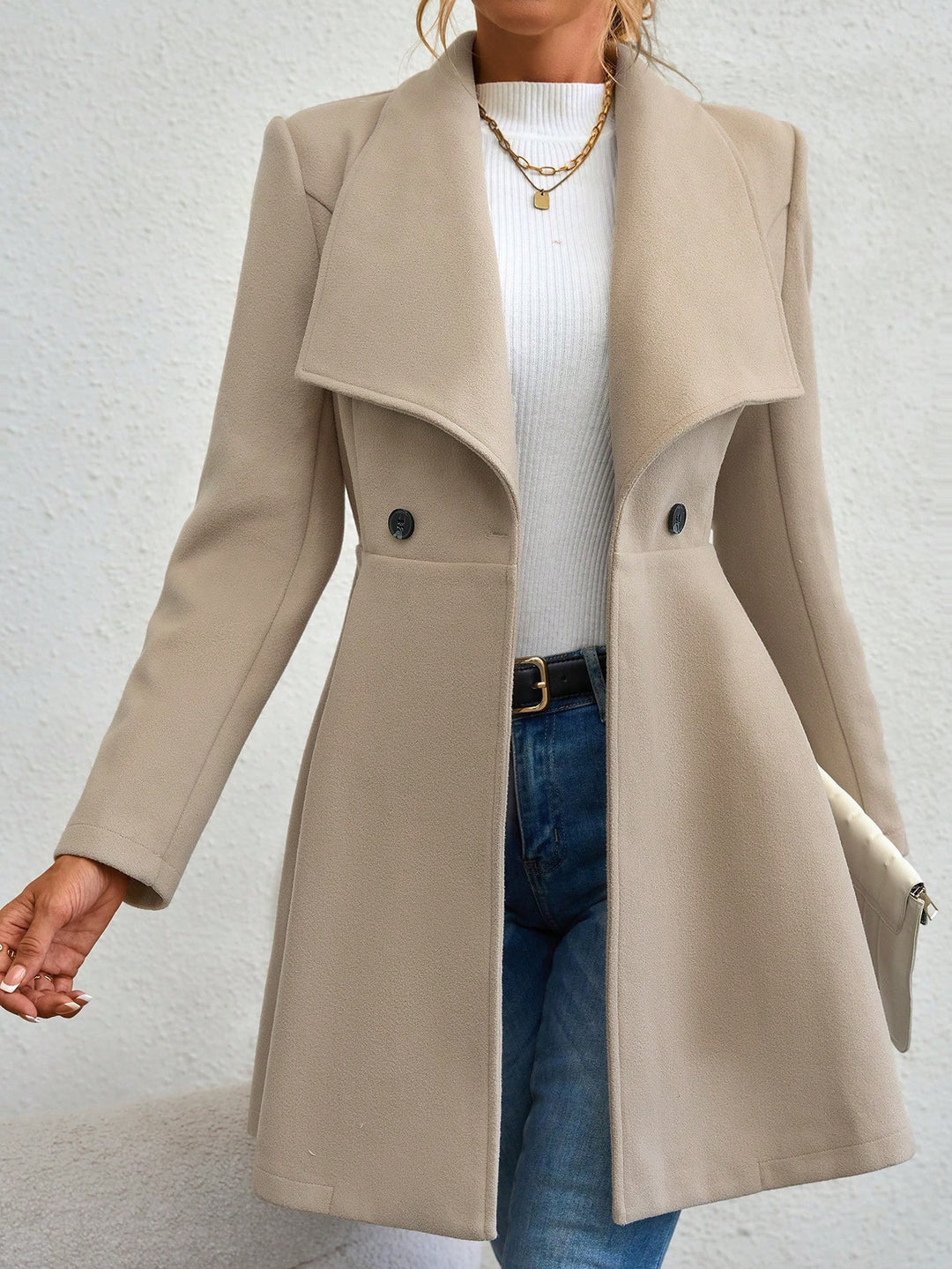 Ladies elegant wool coat with a loose and cinched silhouette and modern button details Lune London