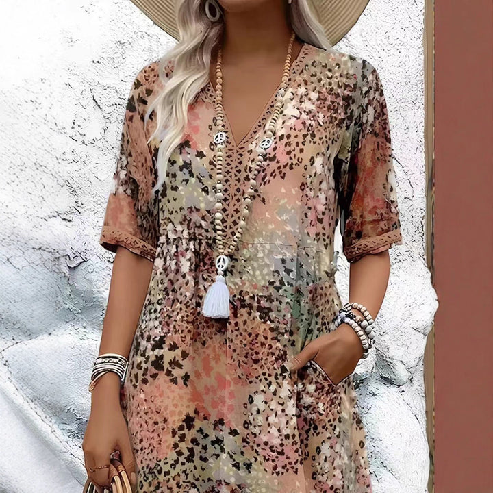 Maxi dress for women with V-neckline and practical side pockets Lune London