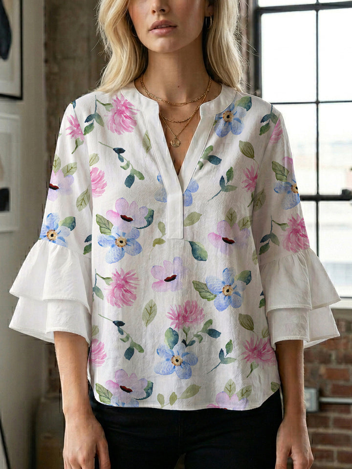 Ladies elegant blouse shirt with voluminous puff sleeves and graphic floral design Lune London