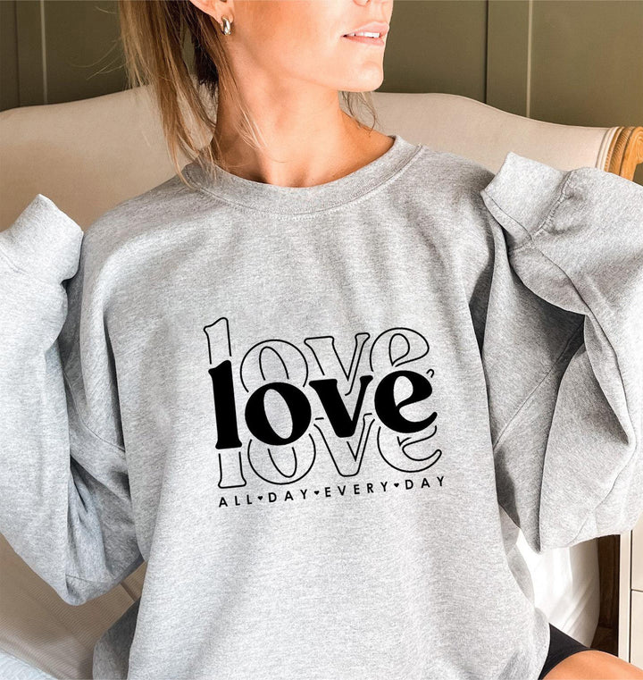 Sweat-shirt pour femmes avec des manches volumineuses et imprimé moderne "love" Chic & Stil