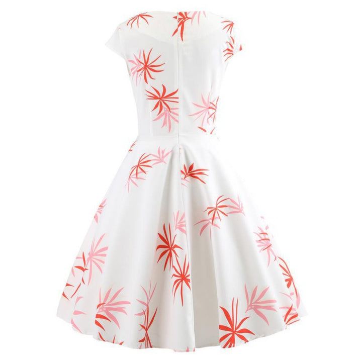 Robe à swing pour femmes avec un design enveloppant élégant et des accents floraux Chic & Stil
