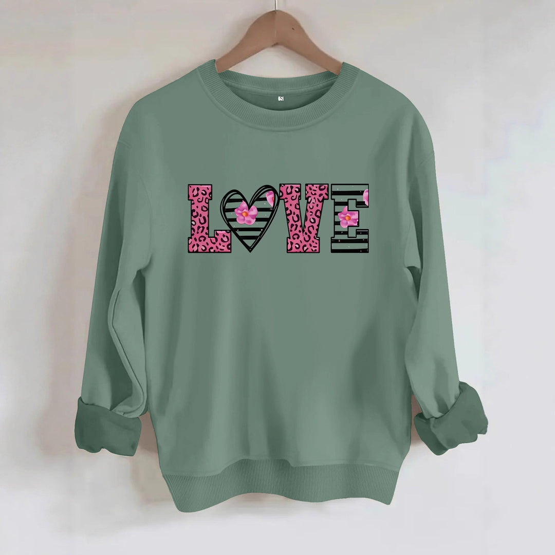 Sweatshirt femme avec design moderne de cœur léopard et coupe confortable Chic & Stil