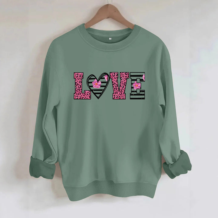 Sweatshirt femme avec design moderne de cœur léopard et coupe confortable Chic & Stil