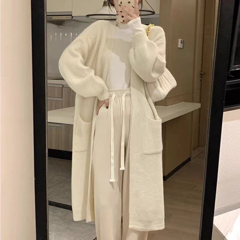 Ladies Long Knit Cardigan with practical pockets and chic elegant silhouette