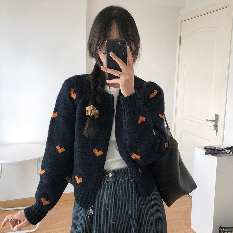 Ladies comfortable cardigan with heart pattern and chic style elegant button detail