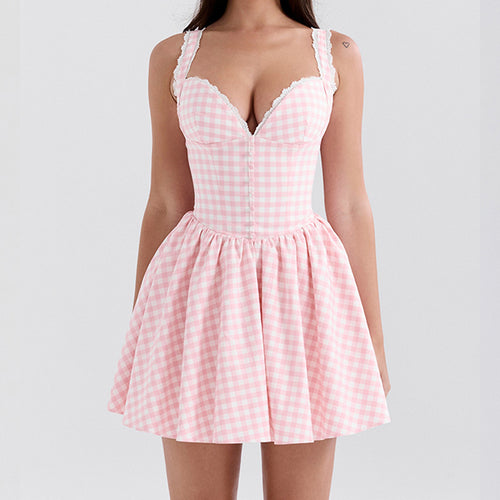 Mini dress for women with V-cut, ruffle details, and checkered pattern Chic & Stil