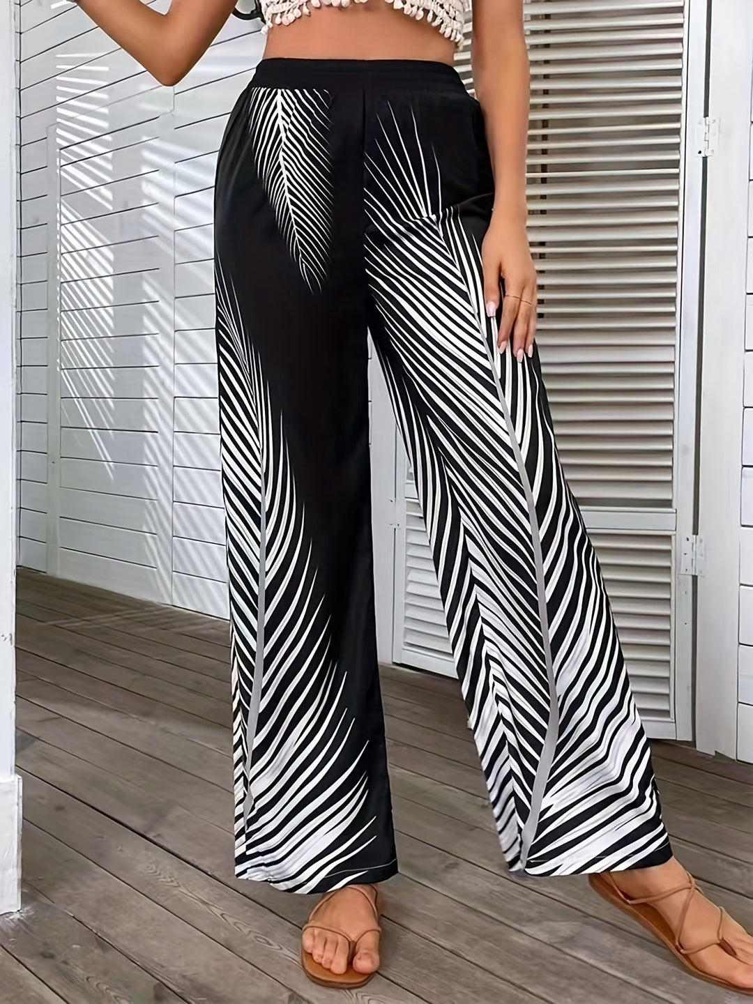 Elegant and lightweight palazzo pants for women with palm tree pattern Lune London