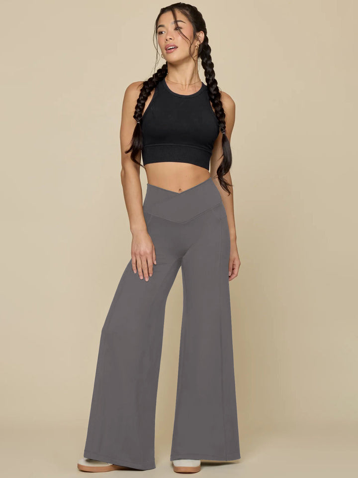 Elegant high-waisted casual trousers for women, with wide legs and practical pockets Lune London