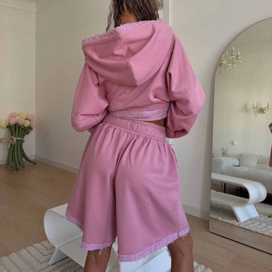 Ladies oversized sporty hoodie with frayed details and chic and stylish shorts set