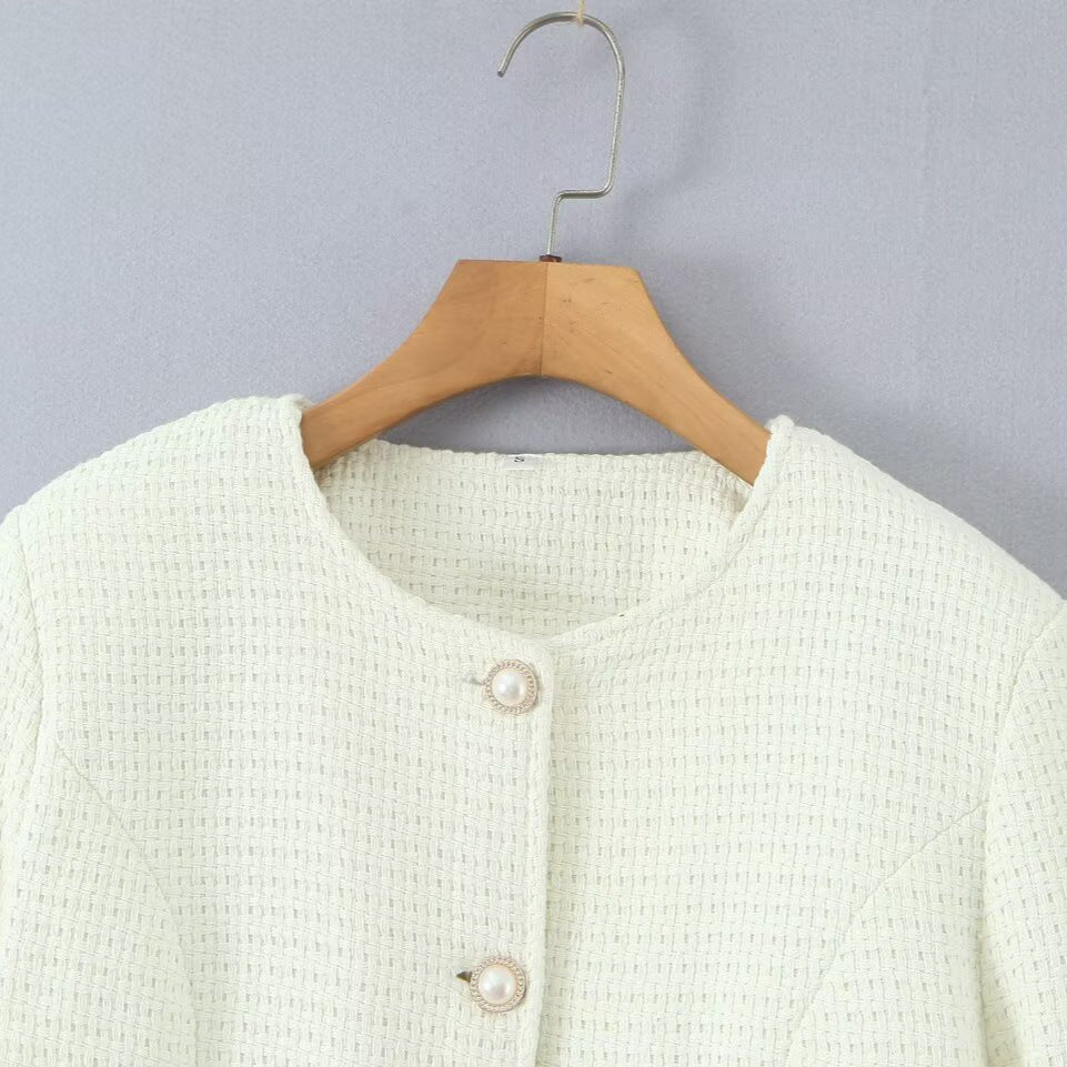 Ladies elegant knitted vest with textured design and pearl buttons Lune London