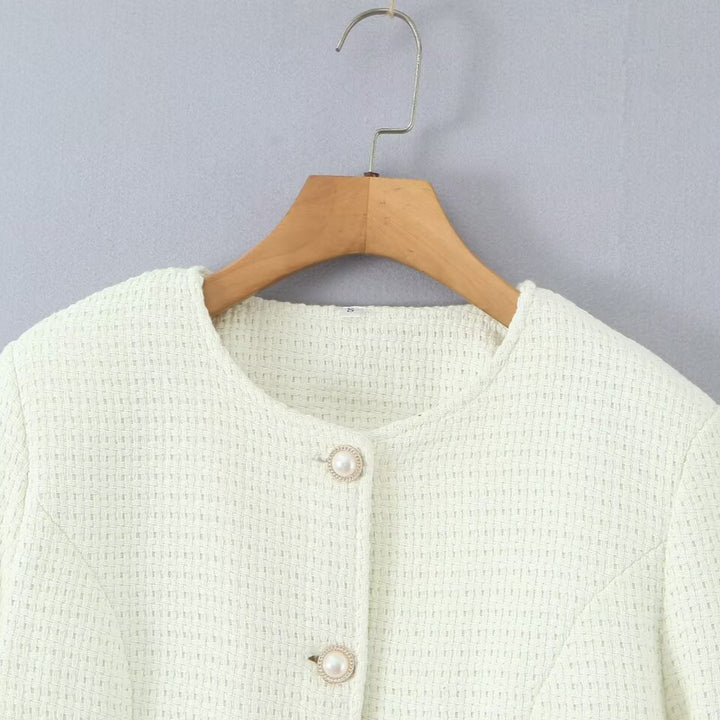 Ladies elegant knitted vest with textured design and pearl buttons Lune London