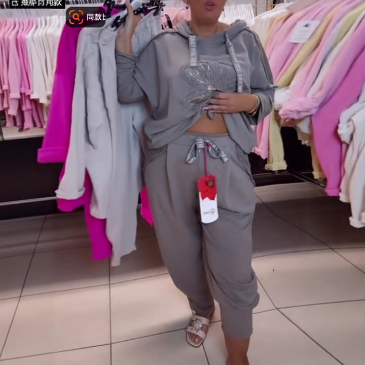 Haut de survêtement décontracté pour femmes avec un motif floral délicat et une broderie de haute qualité Chic & Stil
