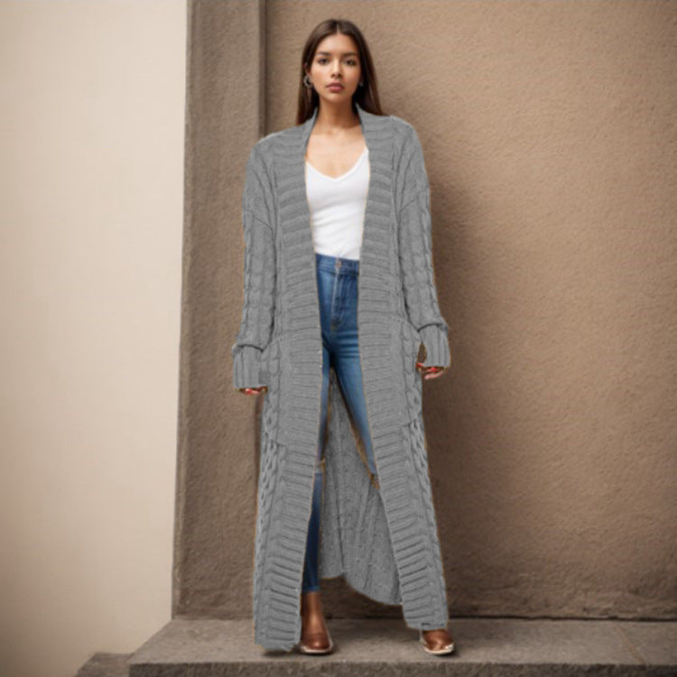 Women Thick knitted cardigan with a refined cable design and practical pockets Lune London