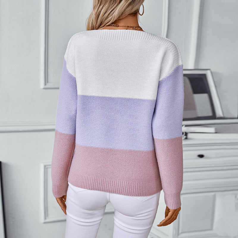 Fashion knit sweater for women with decorative button details and block stripes.