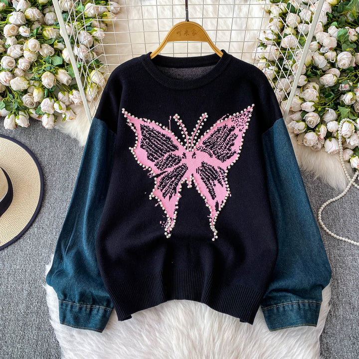 Pull élégant pour femmes avec motif de papillon et manches en denim Chic & Stil