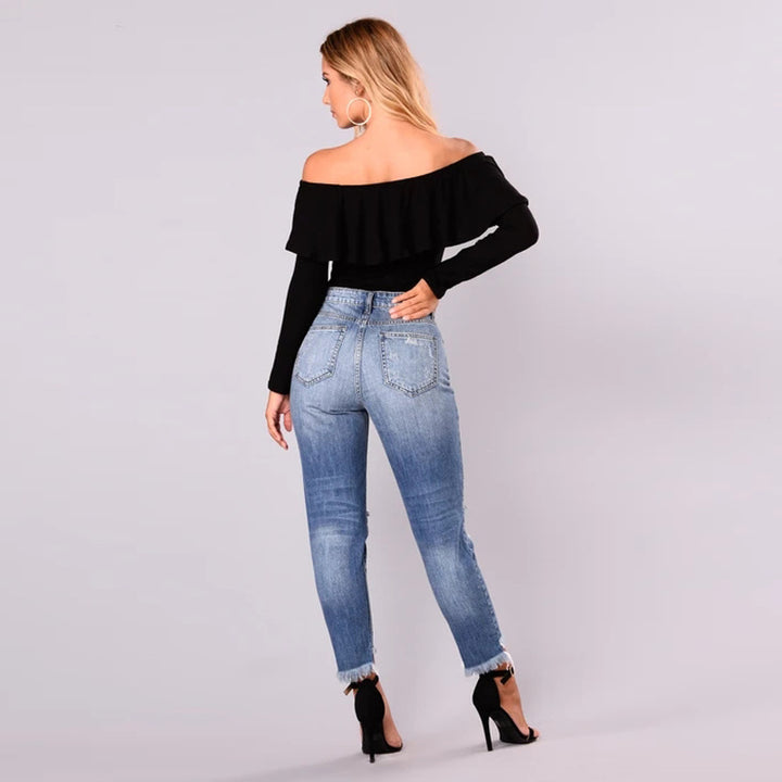 High-waisted jeans for women with a modern destroyed look featuring a trendy frayed hem Lune London