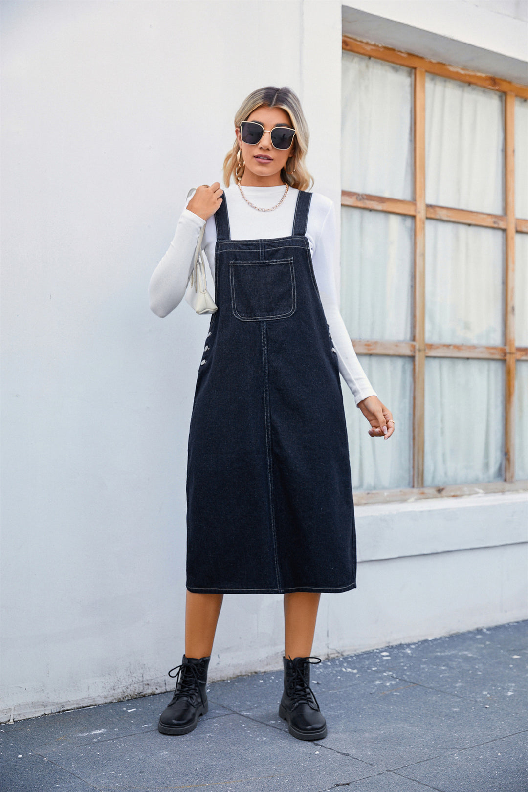 Lune London women's denim strap dress with practical side pockets and modern cut