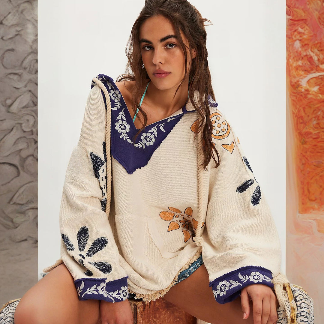 Hooded poncho for women with colorful embroidery and fringed edges Lune London